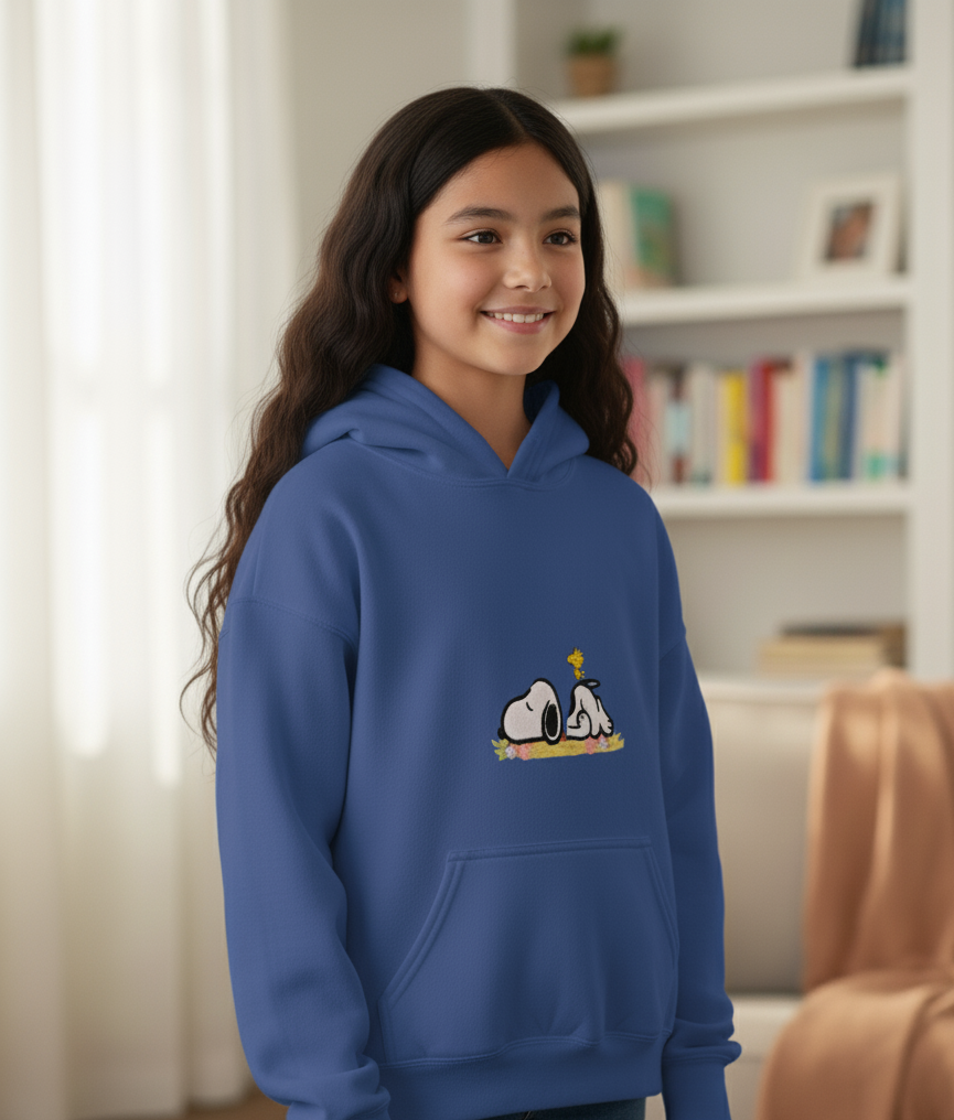 Young girl wearing a blue hoodie with a cartoon character Snoopy embroidered 