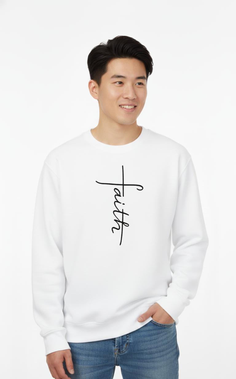 Man wearing a white sweatshirt with 'faith' embroidered on it in black thread 