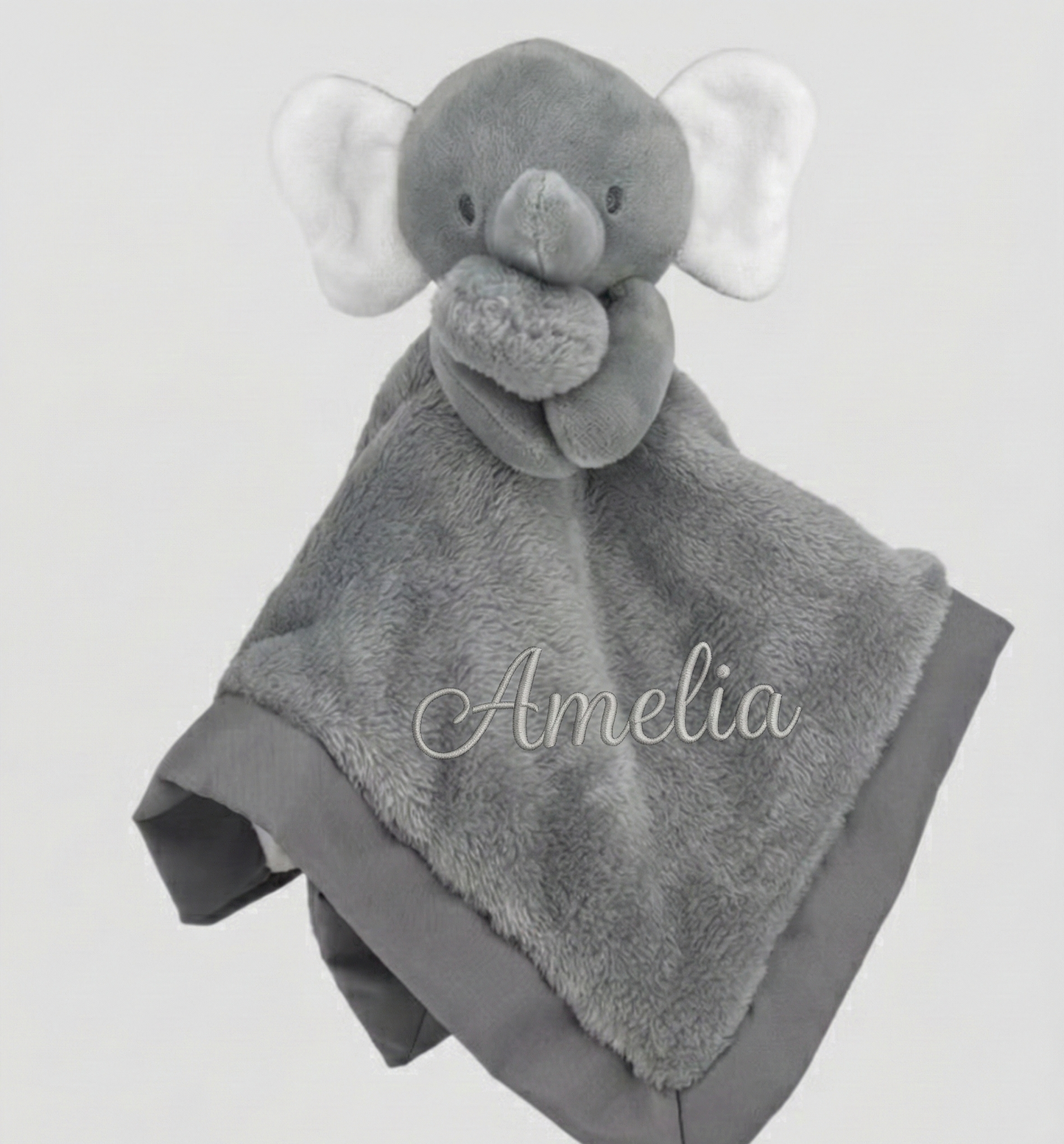 Gray elephant-shaped plush toy with blanket, personalized with 'Amelia', on a light gray background