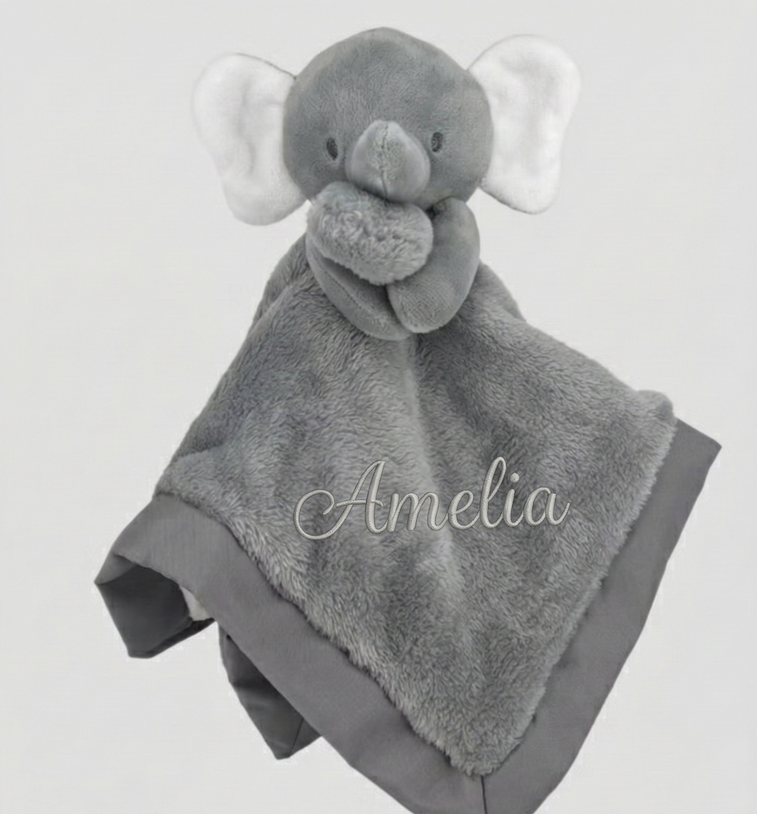 Gray elephant-shaped plush toy with blanket, personalized with 'Amelia', on a light gray background