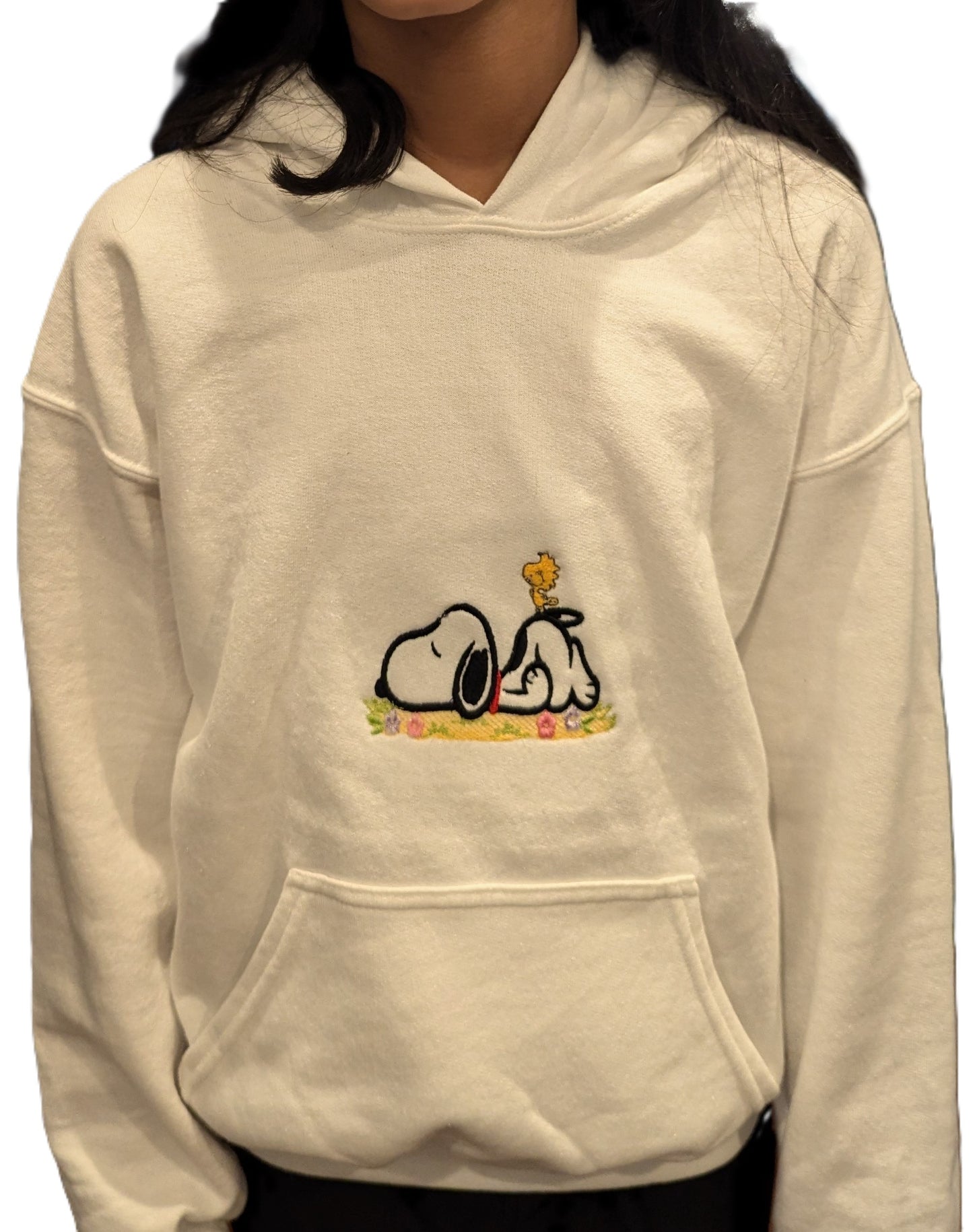 Beige hoodie with Snoopy cartoon character design embroidered on a white background