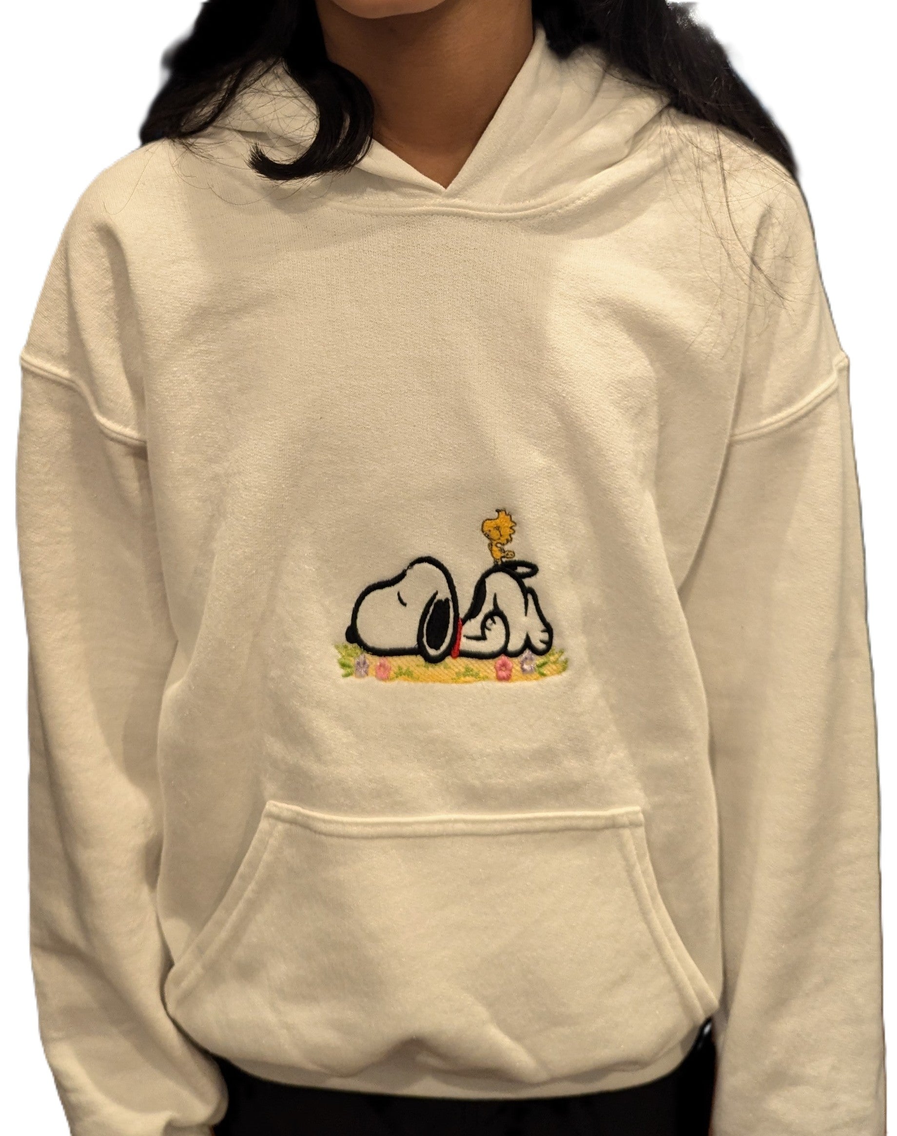 Beige hoodie with Snoopy cartoon character design embroidered on a white background