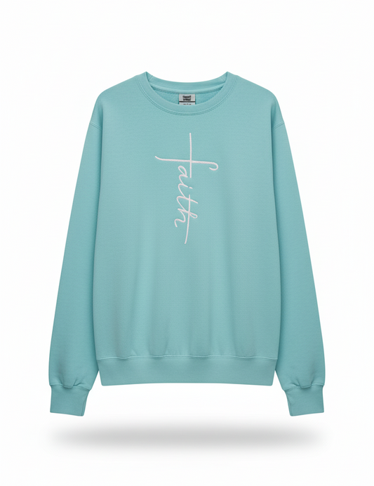 Light blue sweatshirt with a white cross and faith design embroidered In white thread 