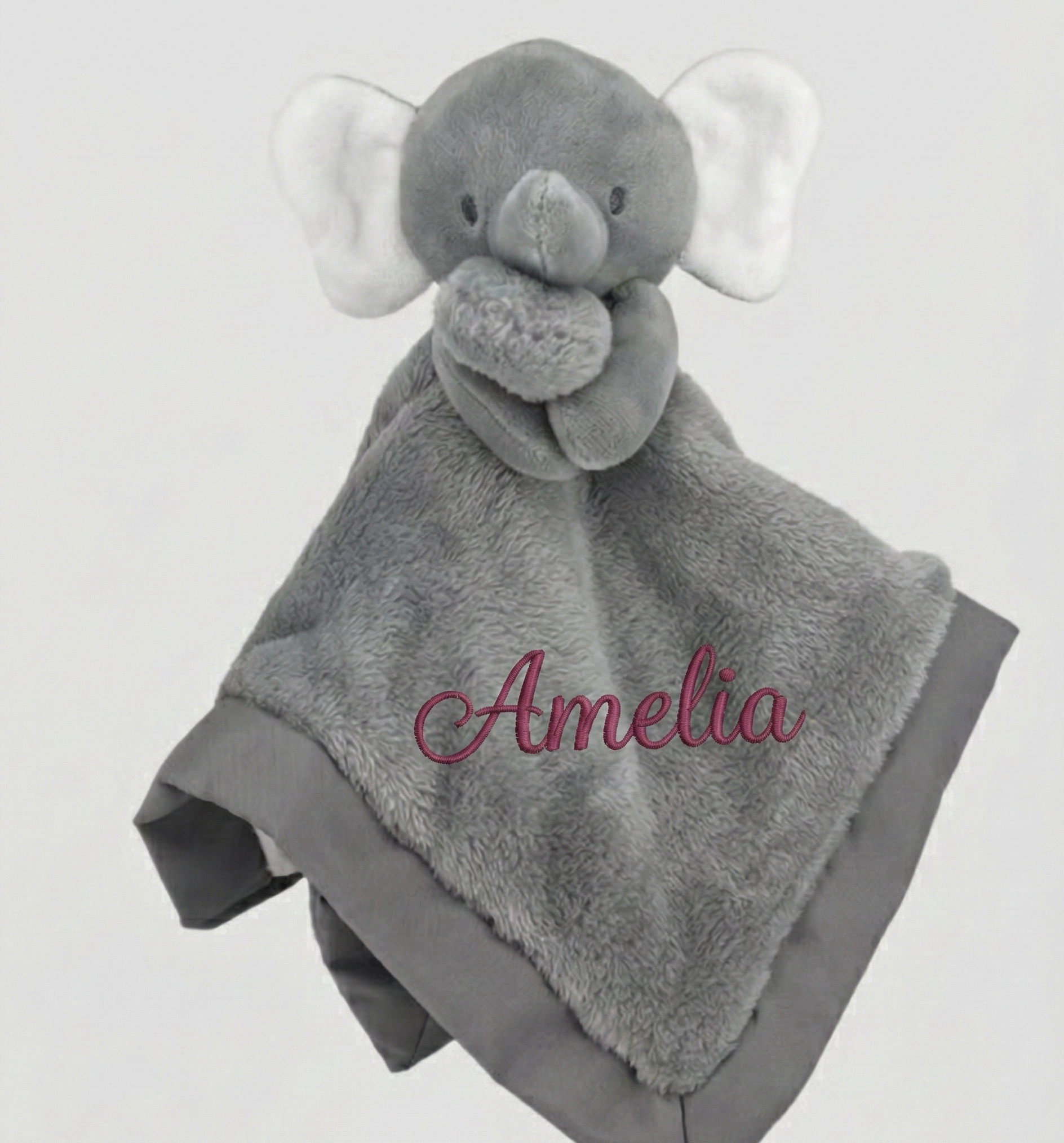 Gray elephant-shaped security blanket with 'Amelia' embroidered in pink thread